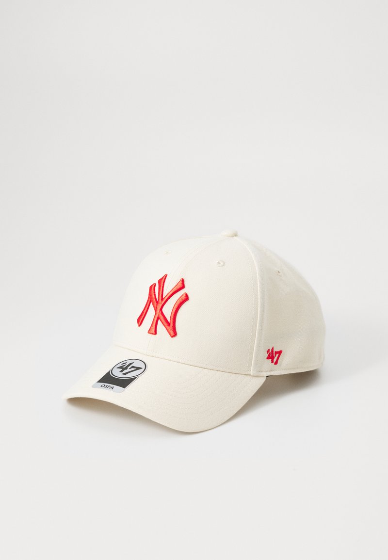 Cream cap with a structured design, featuring a red embroidered 'NY' logo on the front and a small red '47' on the side.