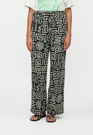 Black wide-leg pants with cream geometric patterns, elastic waistband, and lightweight fabric, featuring sun and plant motifs.