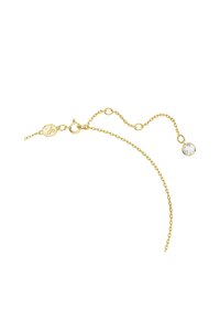 Guld kædearmbånd med rund klar krystalaccent. Delikate led med en rund lås og et logoskilt. Simpelt, elegant design.