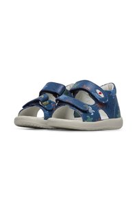 Blauwe sandalen met twee klittenbandsluitingen, voorzien van een textuur bovenkant en kleurrijke maritieme patronen. Gemaakt met een flexibele zool.