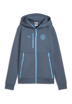 Mørkegrå hættetrøje med lynlås og lyseblå lynlåse, Puma-logo og Manchester City-emblem på brystet.