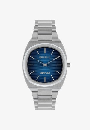 Sølv rustfrit stålværk med et octagonalt uransigt, blå tekstureret urskive, sølv time.markører og en metal link armbånd.