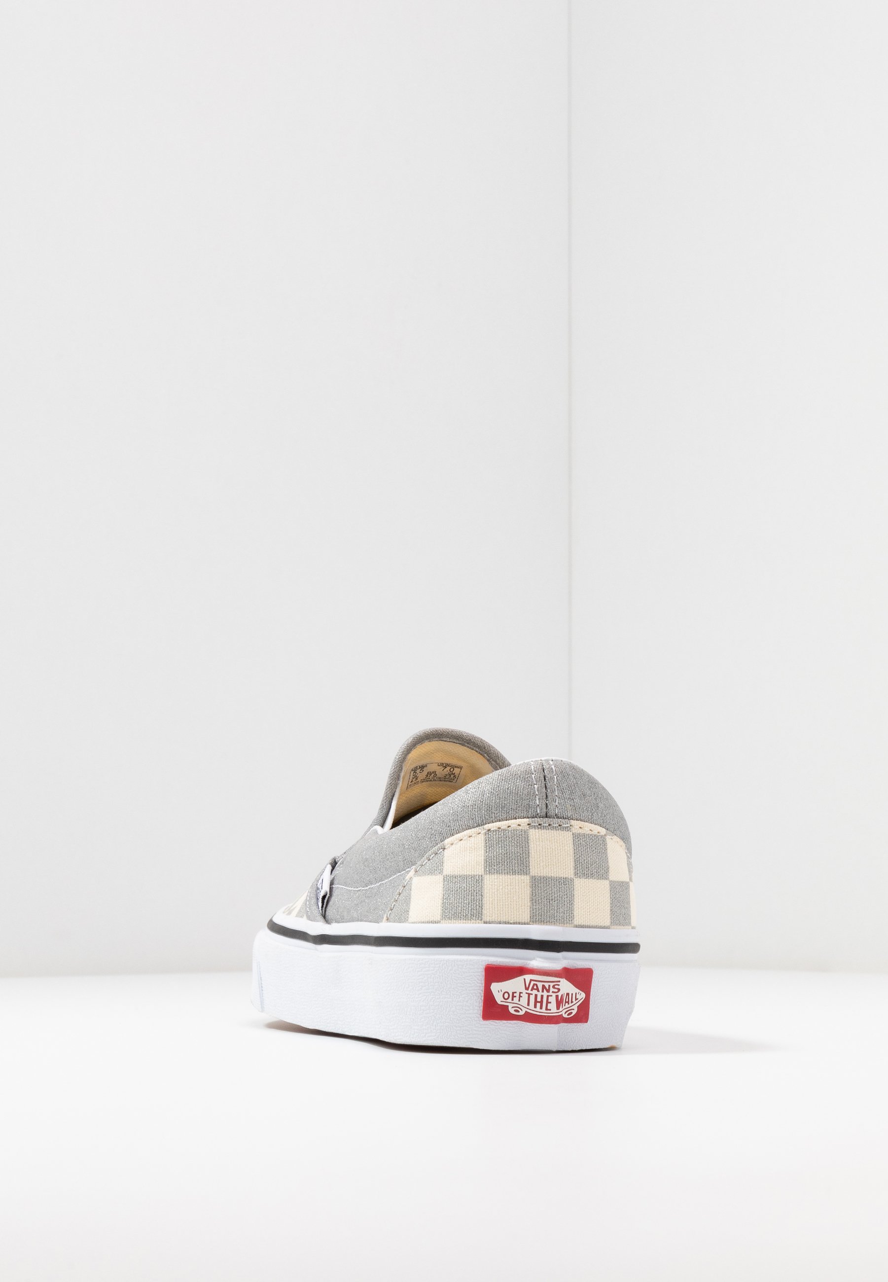 vans checkerboard slip on silver