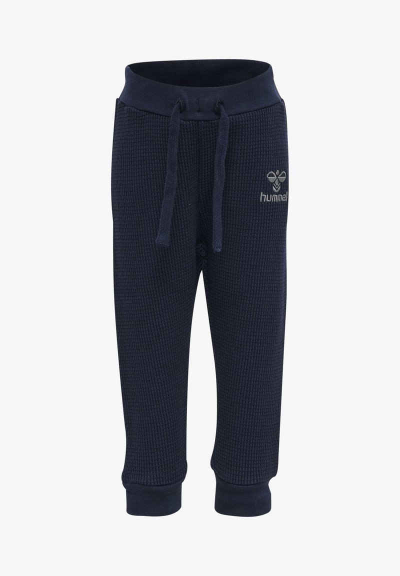 Marineblauwe sweatpants met wafelstructuur, voorzien van een elastische tailleband, verstelbare trekkoord en ribgebreide manchetten. Inclusief een logo op de voorkant.