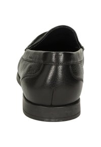 Zwarte leren schoen met een gladde textuur, ronde neus, lage hak en subtiele stiksels. De zijkanten en bovenranden zijn licht gebogen.