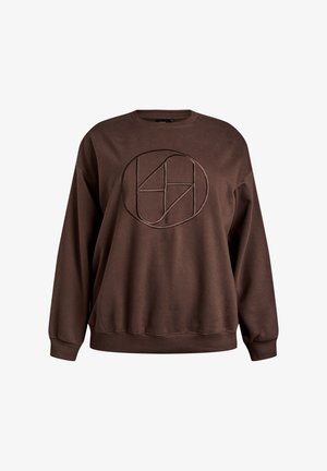 Rudi džemperis, pagamintas iš minkštos medžiagos, su apvaliu logotipu tamsesniu atspalviu. Jis turi apvalią apykaklę ir ribotas rankogalius.