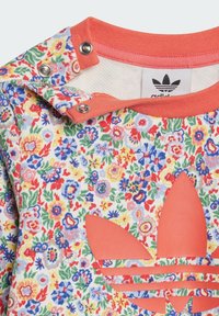 Blumenmuster Sweatshirt aus Baumwolle mit kragen in Korallenfarbe. Mit einem auffälligen korallenfarbenen Logo und horizontalen Streifen.