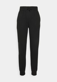 Svarta sweatpants med elastisk dragsko i midjan, sidofickor, manschetter vid anklarna och diskret vit text på vänster ben.