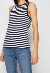 Marinblå och vit randig ärmlös topp med rund halsringning, tillverkad av mjukt tyg, med en avslappnad passform och rak fåll.