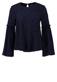 Blusa a maniche lunghe di un blu navy con maniche a campana, caratterizzata da un collo rotondo e un dettaglio a occhiello sulla parte posteriore. Tessuto morbido e testurizzato.