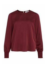 Blusa bordeaux in tessuto morbido, con lunghe maniche a sbuffo con polsini arricciati e scollatura rotonda, chiusura con zip sul retro.
