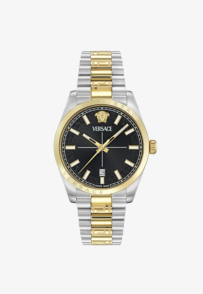 Hõbe- ja kuldtooni roostevabast terasest kell musta lõuendiga, kuldsete detailide ja mustrilise korona, kuupäevanäidiku ning kolme nõela liikumisega.