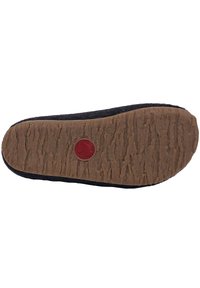 Black fabric slipper sole with textured brown rubber base and a circular red logo. The design features a flat profile and smooth edges.