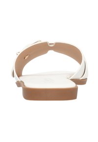 Infradito bianche con una tomaia liscia, cinturini sottili e una suola in gomma marrone. Presentano un piccolo accento dorato vicino ai cinturini.