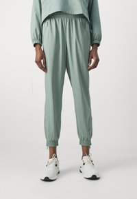 Girlfriend Collective SUMMIT TRACK PANT - Treniņtērpa apakšdaļas - chinoiserie