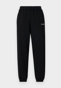 Schwarze Jogginghose mit elastischem Bund und schmal zulaufenden Bündchen. Mit kleinem weißen "No Problemo"-Logo auf dem linken Oberschenkel. Weicher Materialtextur.