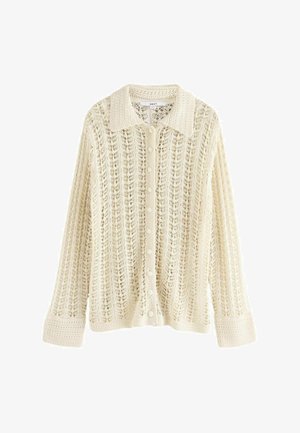 Cardigan in pizzo color crema, con scollo colletto, chiusura a bottoni e maniche lunghe. Presenta un motivo a tratteggio aperto e polsini a coste.