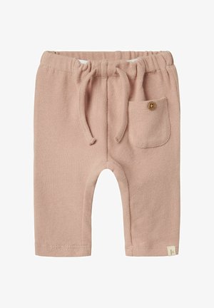 Beige Strick-Jogginghose mit elastischem Bund, Kordelzug und einer kleinen Tasche mit einem Detail aus einem Holzknopf.