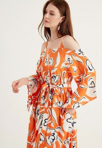 Herita Maxikjoler - orange