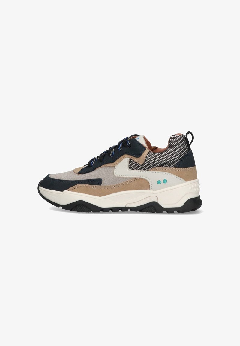 Sneakers with a mix of light brown, navy, and cream materials, featuring a mesh upper, rugged sole, and blue accent details.