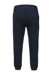 Granatowe spodnie dresowe o miękkiej fakturze, z bocznymi kieszeniami i jedną tylną kieszenią, elastycznym paskiem w talii i ściągaczami na końcach nogawek.