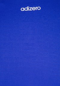 Adizero athletic fabric, bright blue with textured pattern, featuring white branded logo at the top. Smooth, lightweight material.