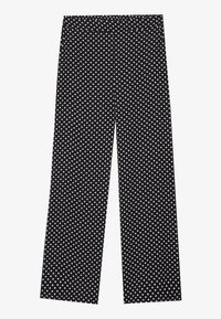 Pantalon noir à jambes larges avec un motif à pois blancs. Confectionné dans un tissu doux à la texture lisse, avec une ceinture élastique.