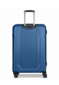 Valigia rigida blu con una texture liscia, manico retraibile e quattro ruote. Presenta sottili scanalature per il design sulla superficie.