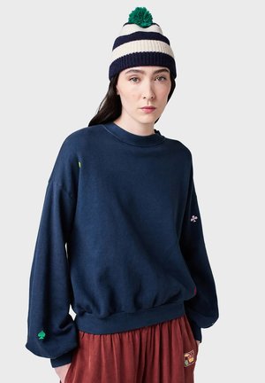 Navy blue sweatshirt made of cotton blend, featuring a round neck, dropped shoulders, and colorful embroidered details on sleeves.