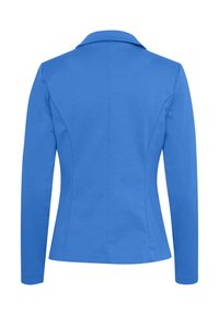 Blazer bleu ajusté à manches longues et col, montré de dos avec des détails de coutures visibles pour une silhouette cintrée.