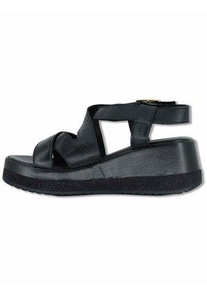 Sandalo con zeppa in pelle nera con cinturini incrociati, cinturino alla caviglia regolabile con fibbia e suola testurizzata per una maggiore aderenza.
