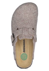 Felt slip-on shoe in light brown with a rounded toe, a decorative buckle, and a textured insole featuring a spiral logo.