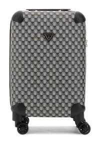 Valise à roulettes avec un motif géométrique noir et blanc agrémenté de touches dorées, coque rigide et quatre roues pivotantes à 360 degrés.