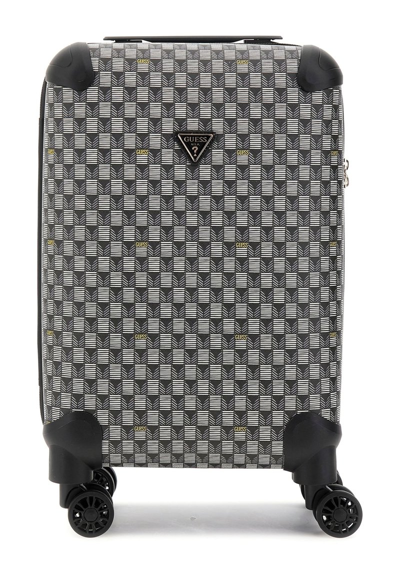 Valise à roulettes avec un motif géométrique noir et blanc agrémenté de touches dorées, coque rigide et quatre roues pivotantes à 360 degrés.