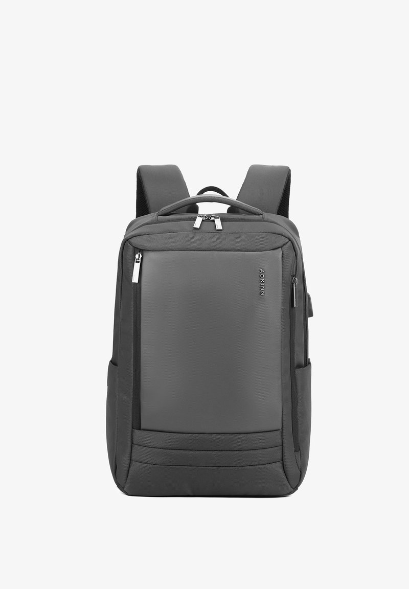 Zaino grigio realizzato in tessuto testurizzato, dotato di schienale imbottito, spallacci regolabili, maniglia superiore, doppi scomparti con zipper e tasche laterali.