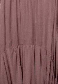 Long, flowing garment in a muted mauve color. Soft, lightweight fabric with gathered detailing at the waist and subtle texture.