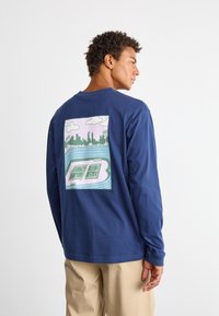 New Balance COURT LONG SLEEVE - Hosszú ujjú felső - navy