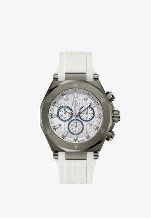 Biały zegarek na silikonowym pasku z ośmiokątną srebrną stalową kopertą, białą teksturowaną tarczą i niebieskimi akcentami na subdyskach chronografu.