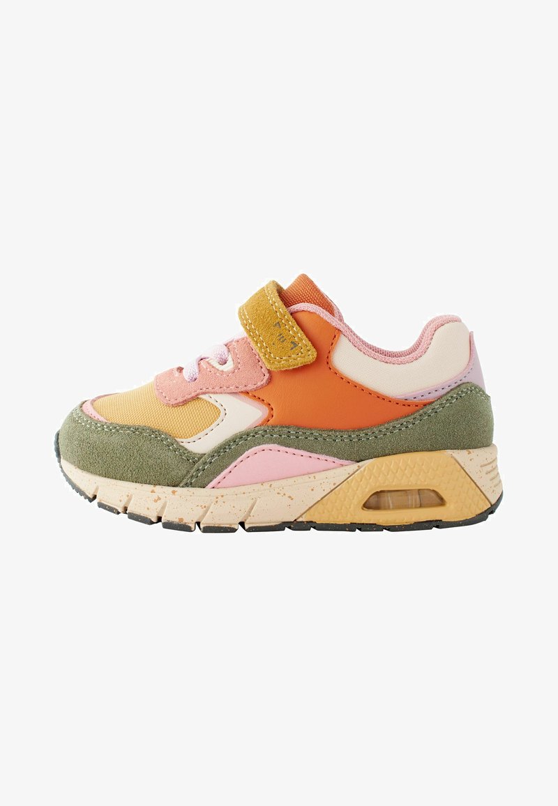 Multicolored sneaker featuring a combination of suede and mesh materials, with a rounded shape, adjustable strap, and textured sole.