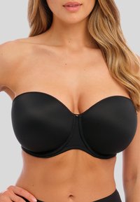 Svart bandeau-bh i slät tyg. Har undertråd för stöd, formar kuppar och en subtil sömdetalj i mitten.