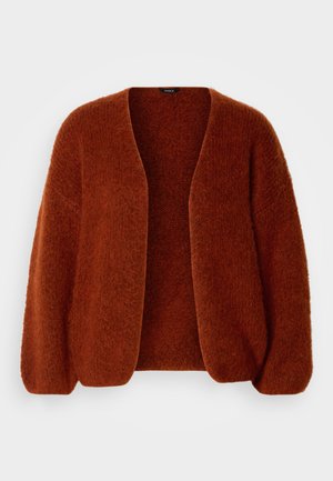 Rostfärgad, överdimensionerad kardigan med ett mjukt, texturerat stickat tyg. Öppen framsidan med lätt puffade ärmar, inga knäppningar.
