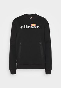 Czarna bluza z okrągłym dekoltem, długimi rękawami i zamykanymi kieszeniami po bokach. Posiada wyraźne białe logo "ellesse" oraz kolorowy emblemat słońca.
