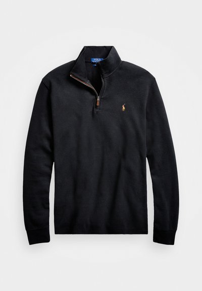 Black fleece pullover with a half-zip collar, featuring a small embroidered logo on the chest and long sleeves with ribbed cuffs.