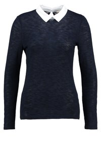 Maglietta a manica lunga blu navy realizzata in tessuto testurizzato, con colletto bianco e un design elegante e aderente.