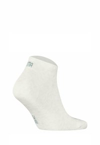 Vita ankelsocka tillverkad av mjukt tyg med ribbad textur. Manschetten har ljusblå logotyp och en förstärkt tå för hållbarhet.