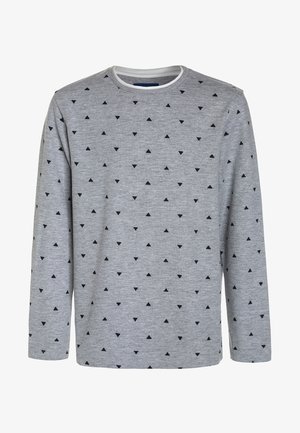 Chemise à manches longues gris clair avec un motif dispersé de petits triangles noirs et une bordure blanche autour du col rond.