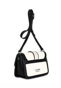 Borsa nera e crema realizzata in pelle e tessuto, con un design strutturato, tracolla regolabile e dettaglio logo "CAFÉ NOIR".