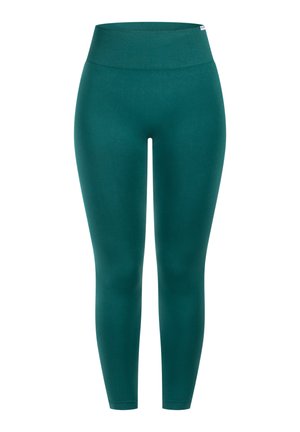 Leggings turchesi con una ampia fascia in costa, silhouette aderente e texture liscia. Nessun motivo prominente o dettagli in metallo.