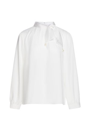 Blouse blanche à manches longues avec col montant, cravate décorative ornée de petits accents en perles et poignets boutonnés.