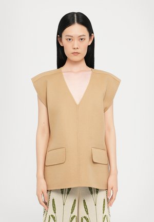 Beige vest with V-neck and short, structured sleeves. Features two side pockets. Made of textured fabric, creating a clean, minimalistic look.